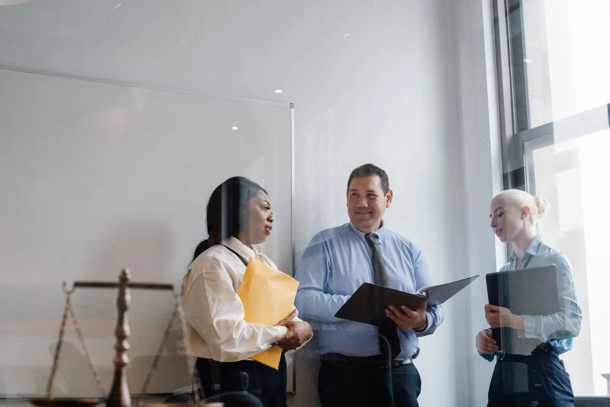 Law firm team discussing compliance requirements in an office