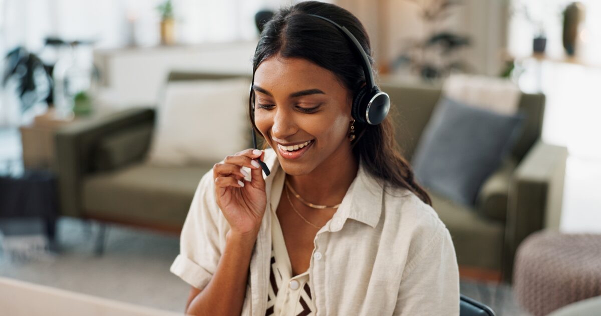 Happy woman, call center and headphones in customer service, support or telemarketing at home offic