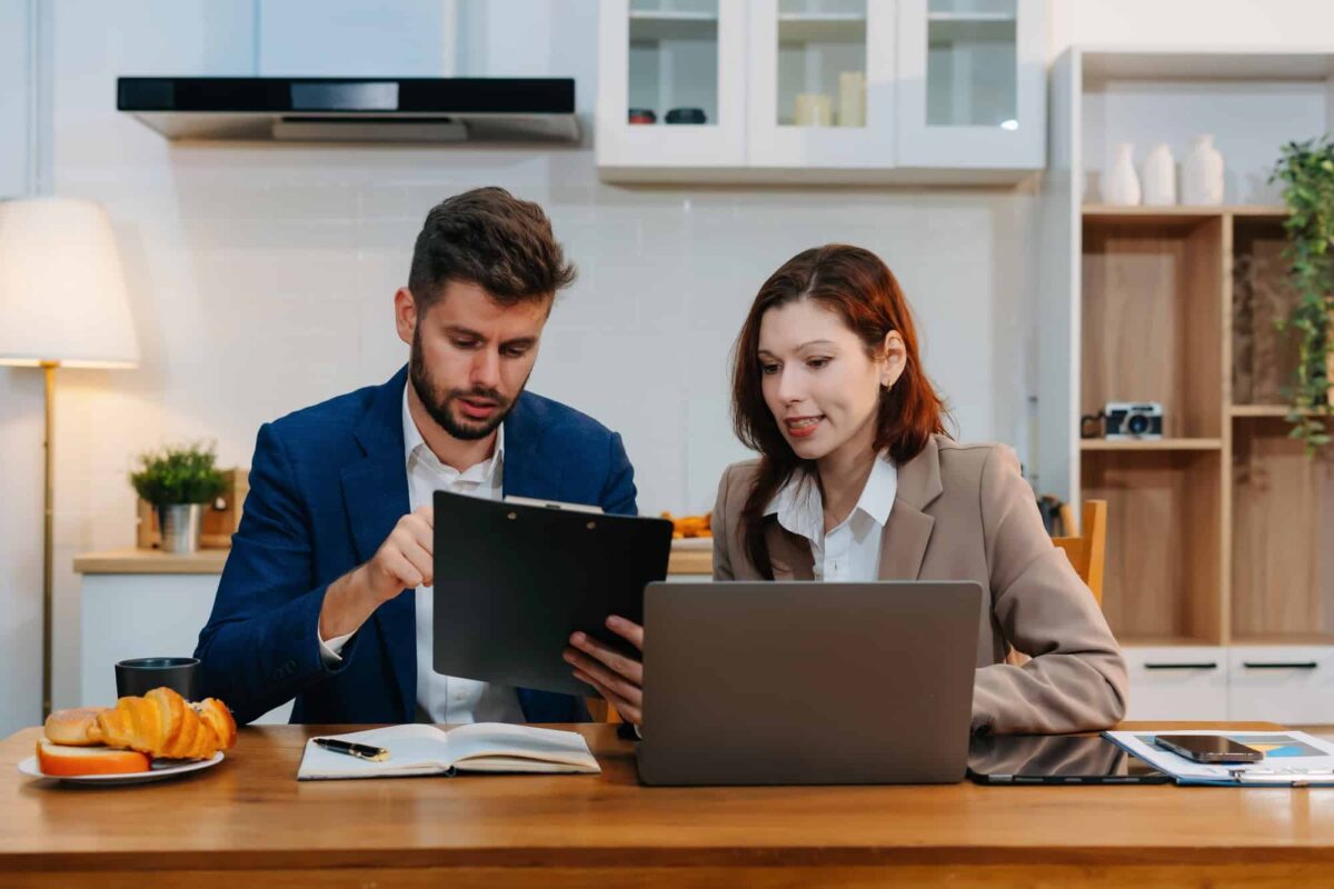 two colleagues working a project or reviewing and discussing a business project.