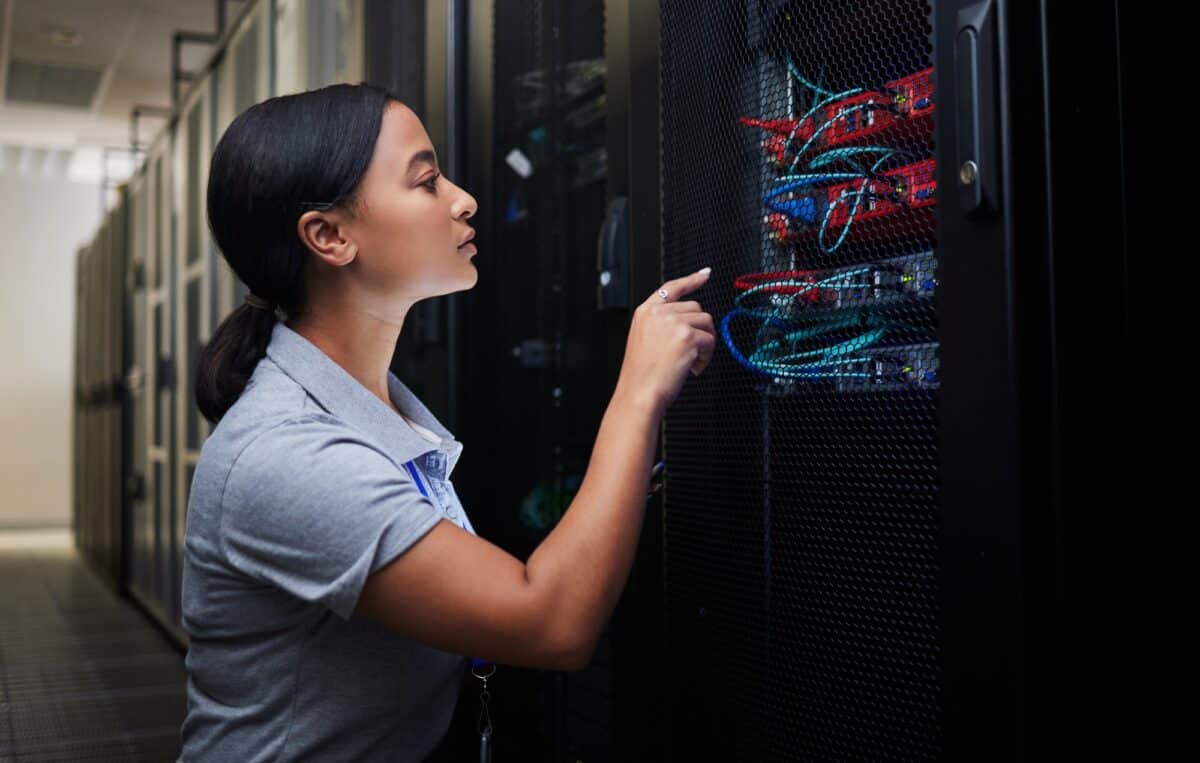 Woman, cable and engineer in server room to check inspection of cloud computing. Information techno