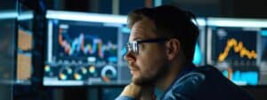a focused cybersecurity analyst intently examines multiple glowing monitors displaying intricate data visualizations in a sleek, modern office, embodying the proactive strategy of continuous threat hunting.
